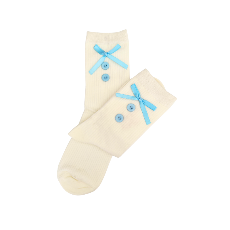 Pair of cream socks with blue bows on a white background
