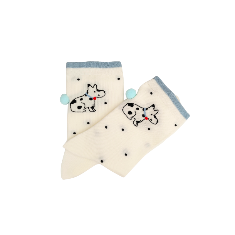 Pair of cream-colored socks with black polka dots and dalmatian dog design on a white background