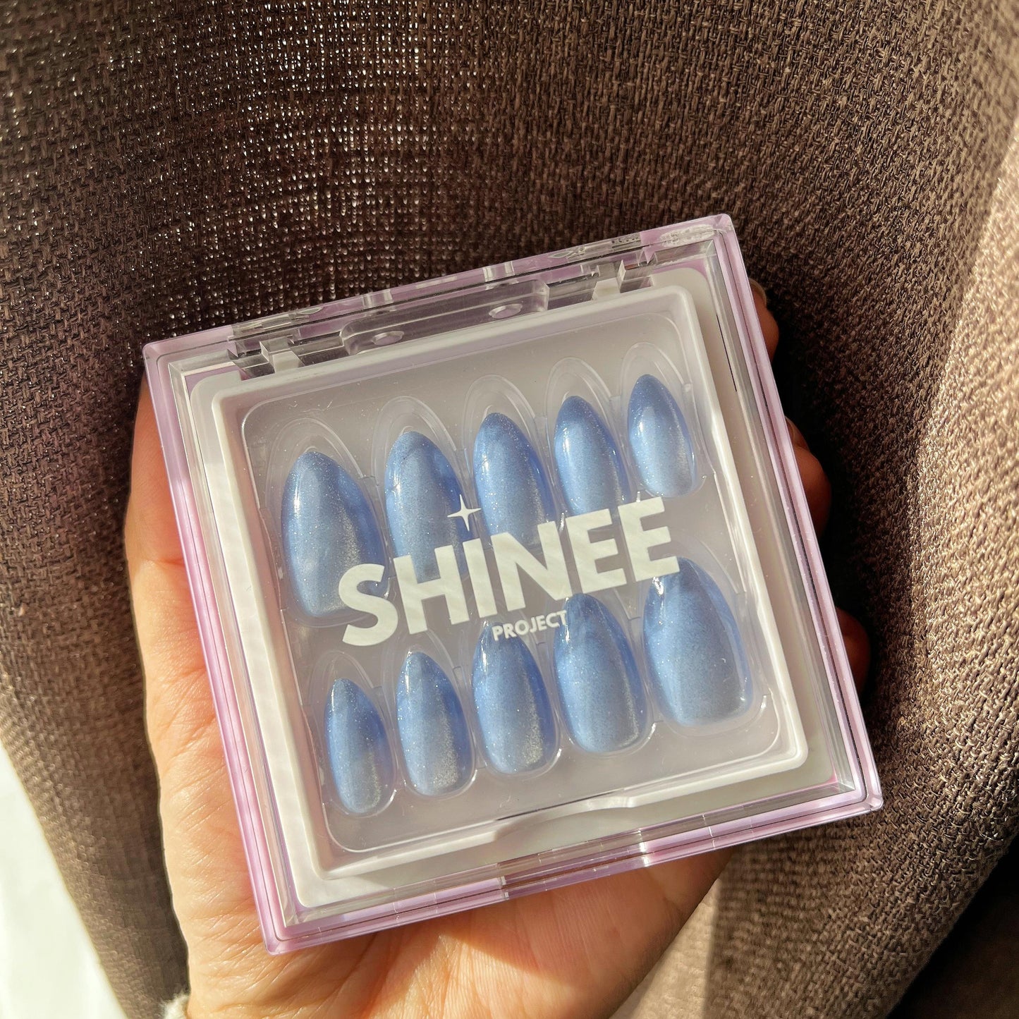 Your go to press on nails - best press on nails nz - almond shape nails - baby blue shimmer