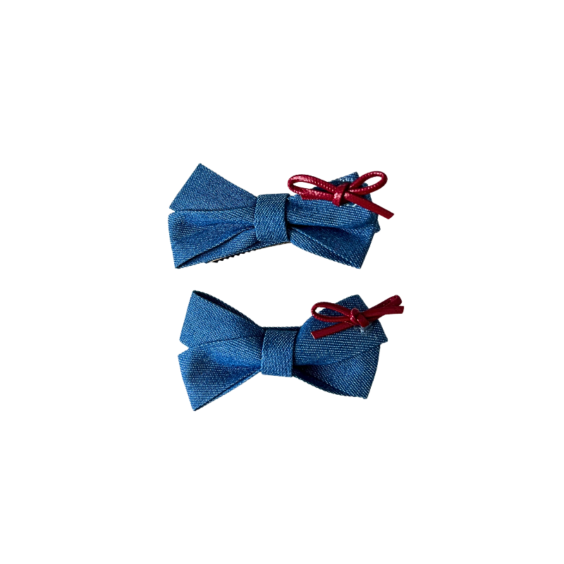 A sweet 2‑piece blue bow hair clip set featuring denim‑style bows topped with tiny red ribbons — perfect for soft‑girl, kawaii, and everyday cute hairstyles.