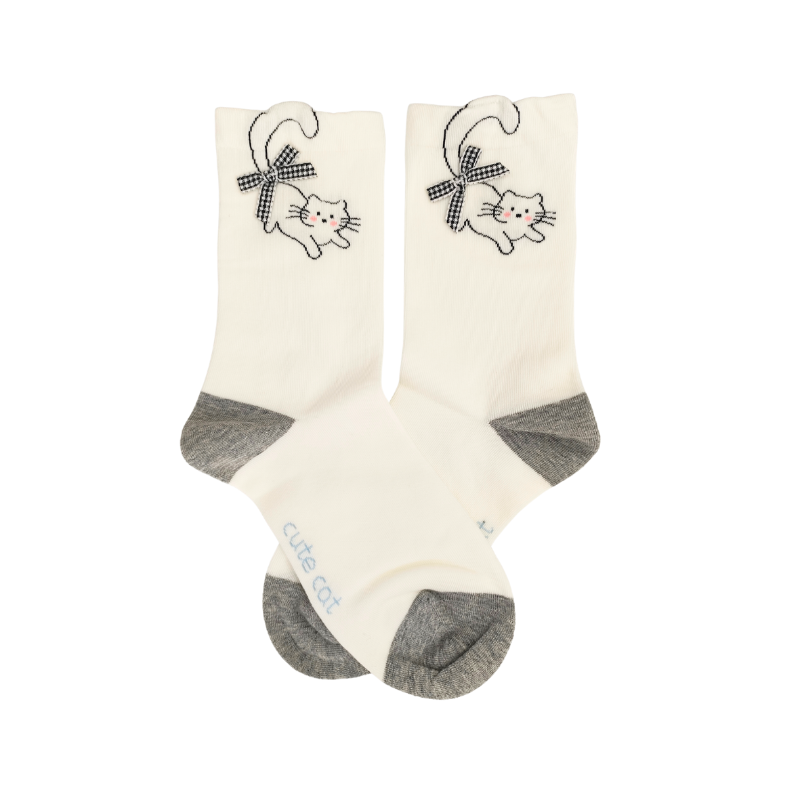 White crew socks with grey toes and an embroidered cat wearing a checkered bow near the cuff.