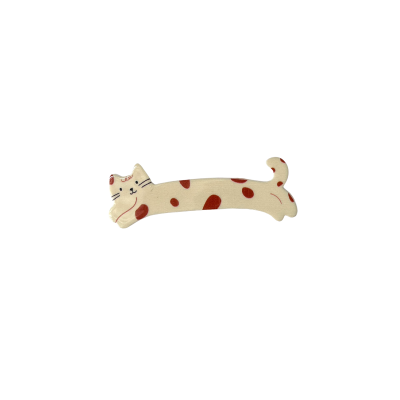 A sweet cream‑coloured cat hair clip decorated with red spots — playful, girly, and perfect for soft‑girl and kawaii hairstyles.