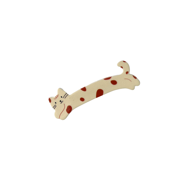 A sweet cream‑coloured cat hair clip decorated with red spots — playful, girly, and perfect for soft‑girl and kawaii hairstyles.