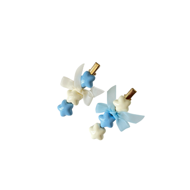 A dreamy pastel hair clip duo featuring blue and white star accents with matching ribbon bows — perfect for soft‑girl, kawaii, and everyday cute hairstyles.