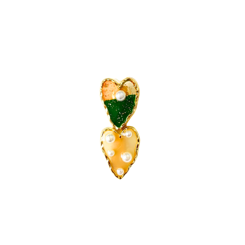 A dreamy double‑heart hair clip with glossy colour, gold trim, and delicate pearl accents — available in two sweet colour options.