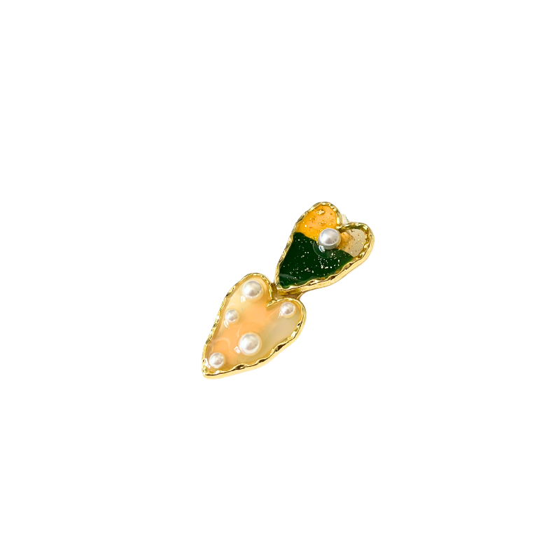A dreamy double‑heart hair clip with glossy colour, gold trim, and delicate pearl accents — available in two sweet colour options.