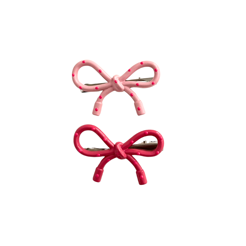 A sweet 2‑piece pink bow hair clip set featuring glossy polka‑dot bows in two shades of pink — perfect for soft‑girl, kawaii, and everyday cute hairstyles.