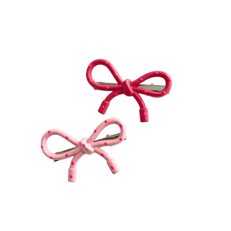 A sweet 2‑piece pink bow hair clip set featuring glossy polka‑dot bows in two shades of pink — perfect for soft‑girl, kawaii, and everyday cute hairstyles.