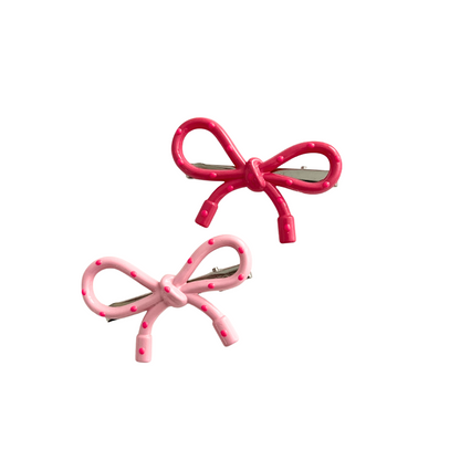 A sweet 2‑piece pink bow hair clip set featuring glossy polka‑dot bows in two shades of pink — perfect for soft‑girl, kawaii, and everyday cute hairstyles.