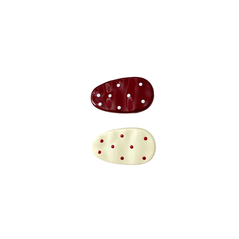 A glossy, soft‑girl bow hair clip available in two adorable colour options — Cream White with Red Dots or Red with White Dots. Cute, playful, and perfect for everyday girly styling.
