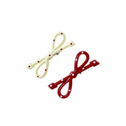 A super cute duo of glossy bow hair clips — available in White & Red or Pink tones. Perfect for soft‑girl, kawaii, and everyday girly hairstyles.