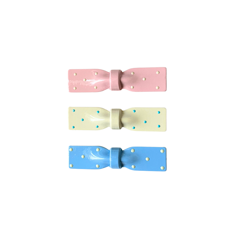 A dreamy 3‑piece set of glossy polka‑dot bow hair clips in pink, cream, and blue — the perfect soft‑girl accessory trio for everyday cuteness.