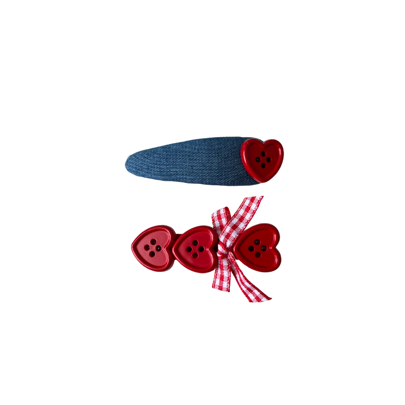 A sweet 2‑piece red heart hair clip set featuring a denim‑style clip with a heart button and a triple‑heart clip with a gingham bow — perfect for soft‑girl, kawaii, and everyday cute hairstyles.