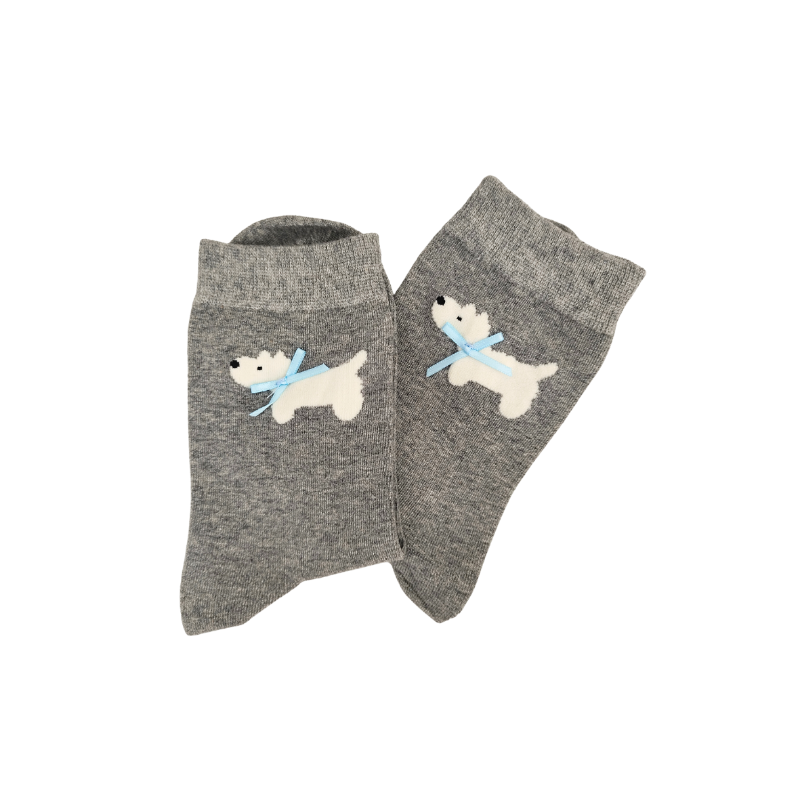 Pair of gray socks with dog design on a white background