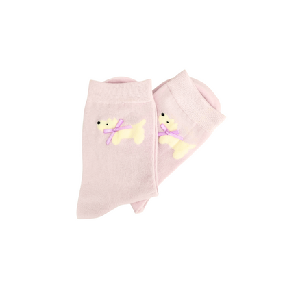 Pink socks with teddy bear designs on a white background