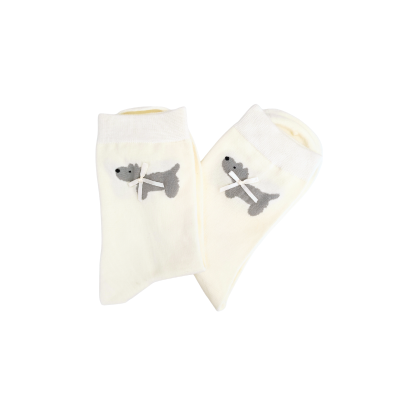 Pair of white socks with gray dog design on a white background