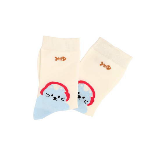 Cream knit socks with a blue cat wearing red headphones near the ankle and a small brown fishbone graphic near the top