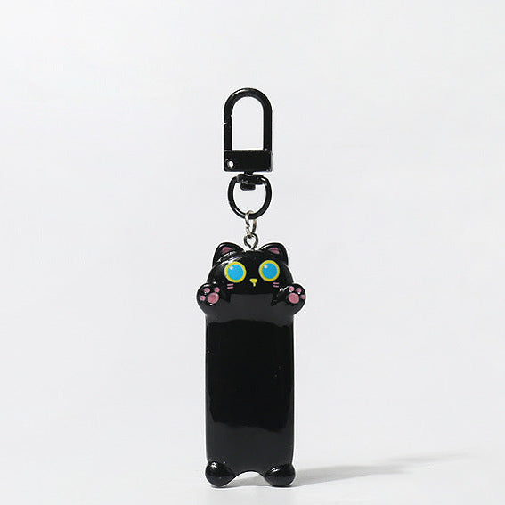 Black cat-shaped keychain with colorful eyes on a white background