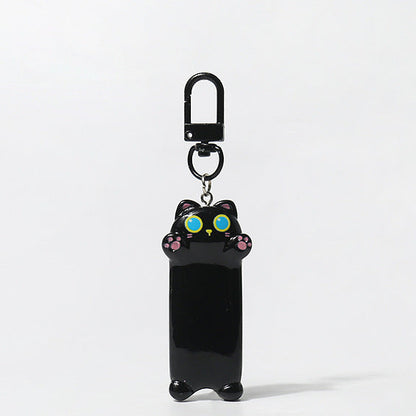 Black cat-shaped keychain with colorful eyes on a white background