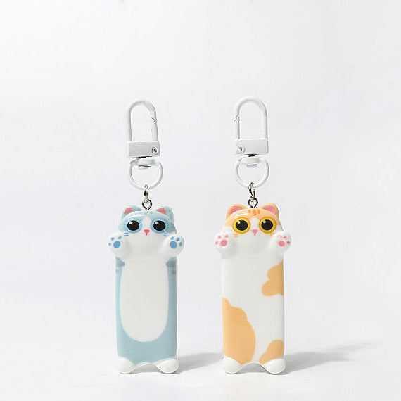 Two cat-shaped keychains on a white background