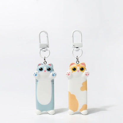 Two cat-shaped keychains on a white background