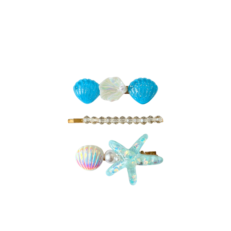 A magical 3‑piece mermaid‑inspired hair clip set featuring shells, pearls, crystals, and a sparkling starfish — perfect for soft‑girl, ocean, and elegant kawaii hairstyles.