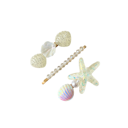 A dreamy 3‑piece ocean‑themed hair clip set featuring shells, pearls, and a sparkling starfish — perfect for soft‑girl, mermaidcore, and elegant kawaii hairstyles.