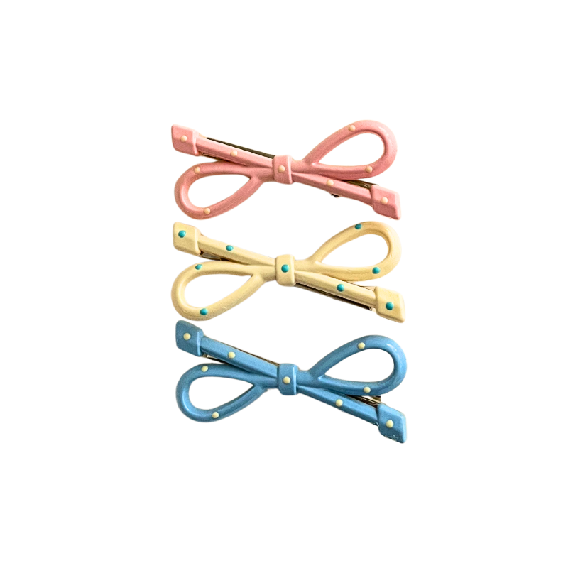 A playful 3‑piece pastel bow hair clip set featuring pink, yellow, and blue polka‑dot bows — perfect for soft‑girl, kawaii, and everyday cute hairstyles.