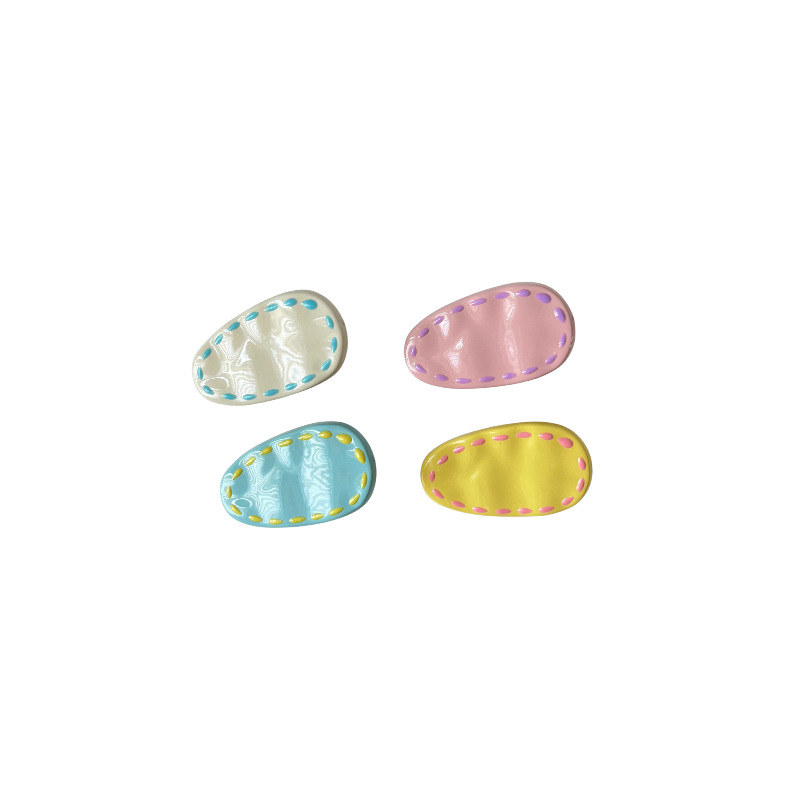 A colourful 4‑piece pastel hair clip set featuring stitched oval designs in cream, pink, blue, and yellow — perfect for soft‑girl, kawaii, and everyday cute hairstyles.