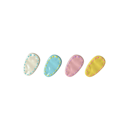 A colourful 4‑piece pastel hair clip set featuring stitched oval designs in cream, pink, blue, and yellow — perfect for soft‑girl, kawaii, and everyday cute hairstyles.