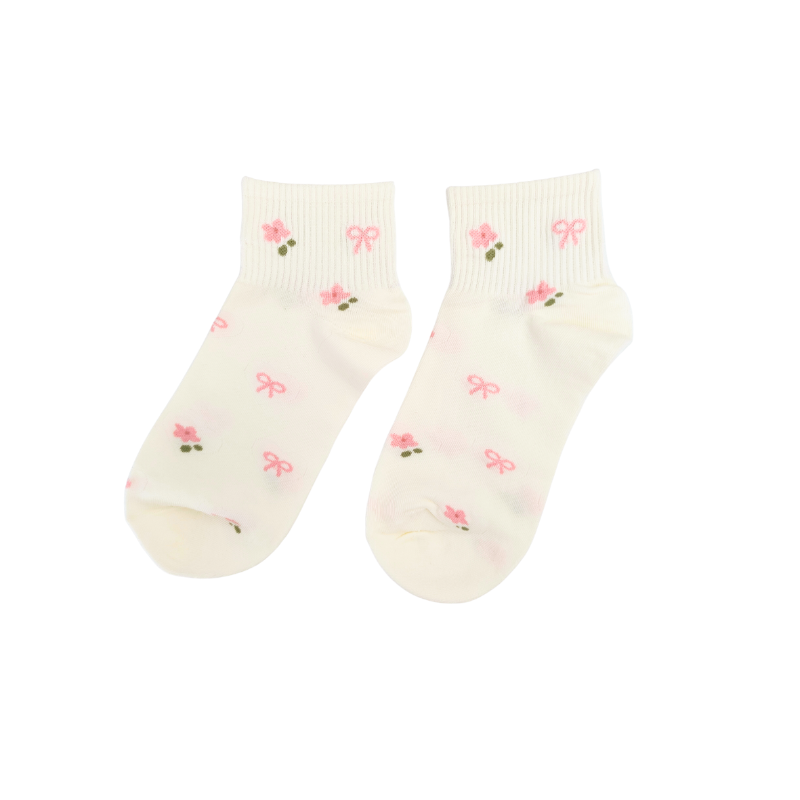 Cream ankle socks with pink bows and flower details. Soft, cute, and perfect for everyday wear or adding a sweet, feminine touch to any outfit