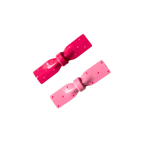 Two pink bow-shaped hair clips on a white background