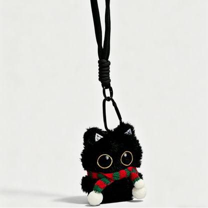 Three black cat plush bag charms with embroidered eyes and striped scarves, each attached to a clip for bags or keys.